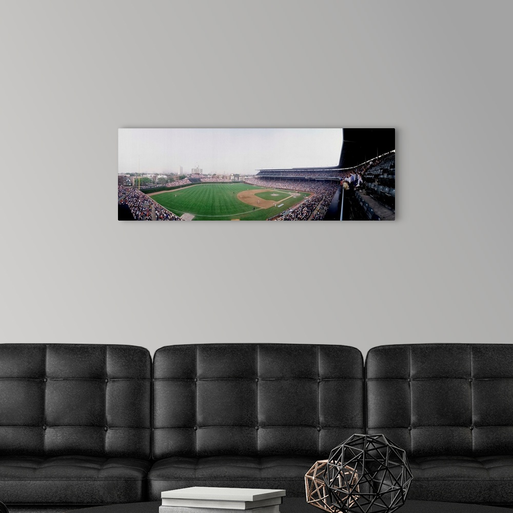 A modern room featuring Spectators watching a baseball mach in a stadium Wrigley Field Chicago Cook County Illinois