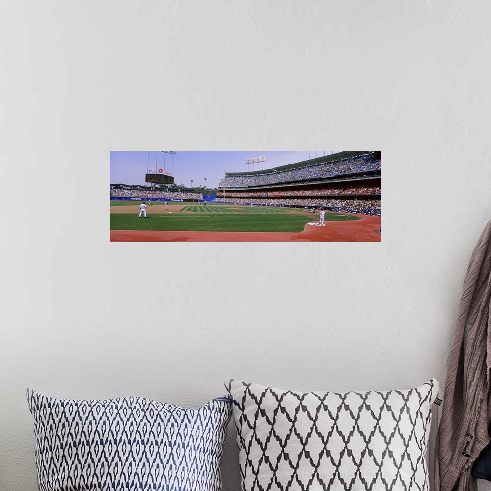 A bohemian room featuring A wide angle photograph taken from the third base side in Dodgers stadium as they play the Yankees.