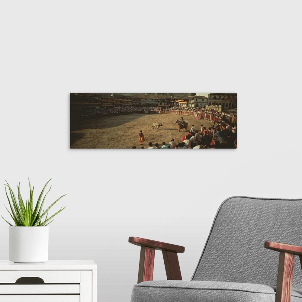 A modern room featuring Spectators watching bullfighting in a stadium, Spain