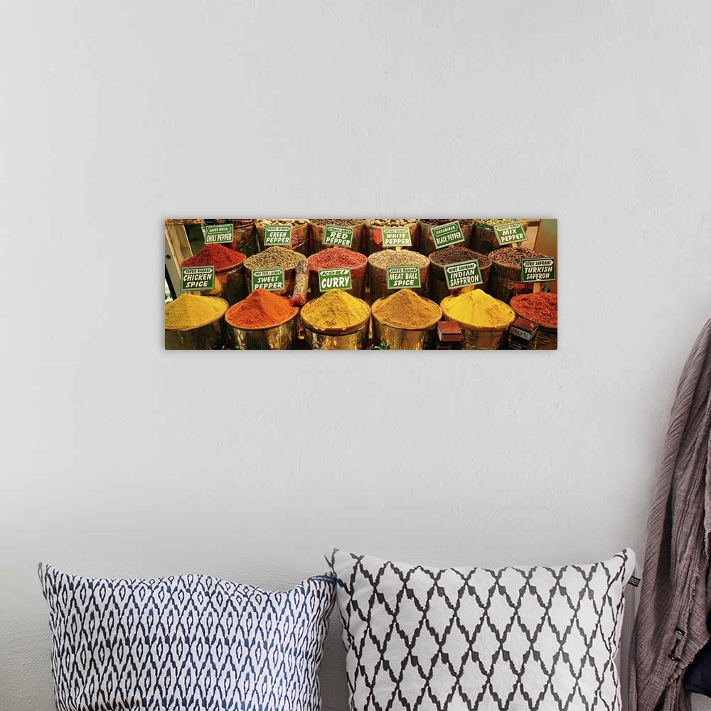 A bohemian room featuring Panoramic image on canvas of buckets of different spices for sale in Turkey.