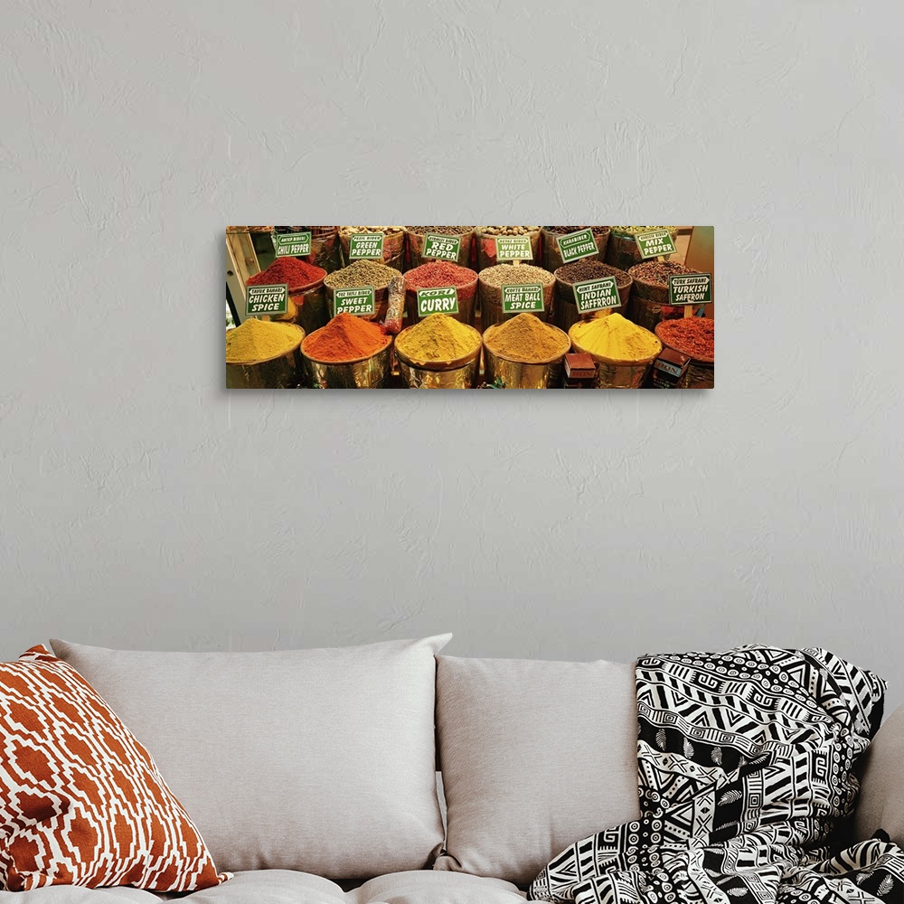 A bohemian room featuring Panoramic image on canvas of buckets of different spices for sale in Turkey.