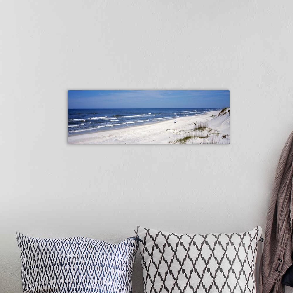 A bohemian room featuring This wall art is a panoramic photograph of a sandy Florida beach lined by dunes on a clear sunny ...