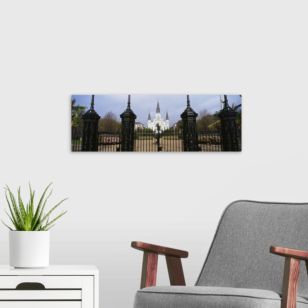 A modern room featuring Panoramic photo on canvas of a big house of worship that is seen through iron fences located in L...