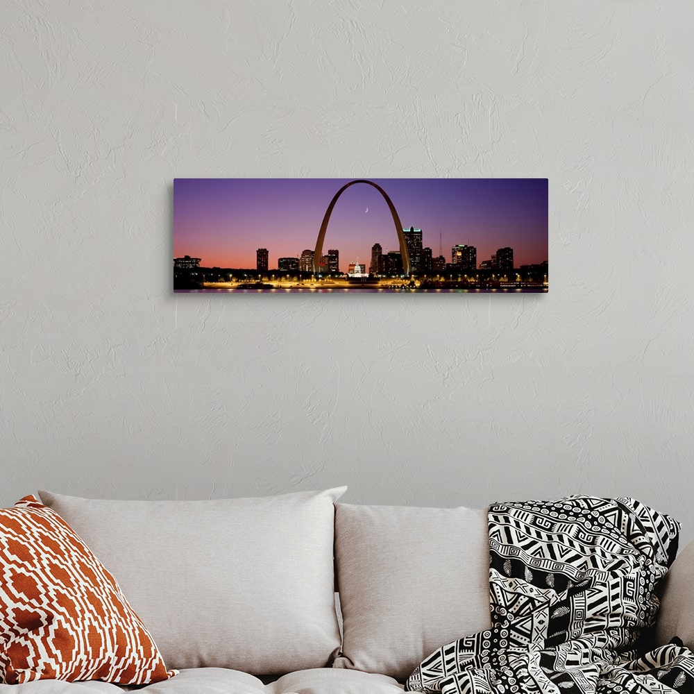 A bohemian room featuring Wide angle view of the St. Louis skyline including the Gateway Arch, at sunset.