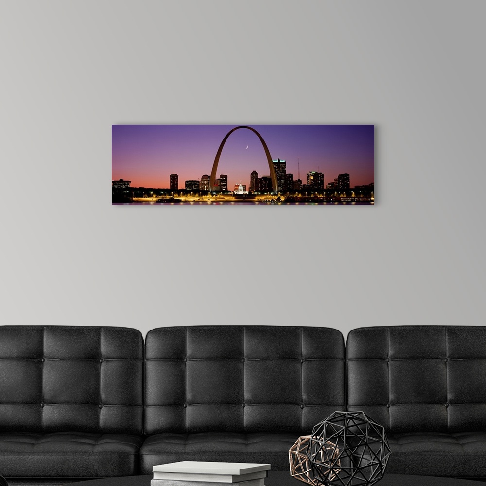 A modern room featuring Wide angle view of the St. Louis skyline including the Gateway Arch, at sunset.
