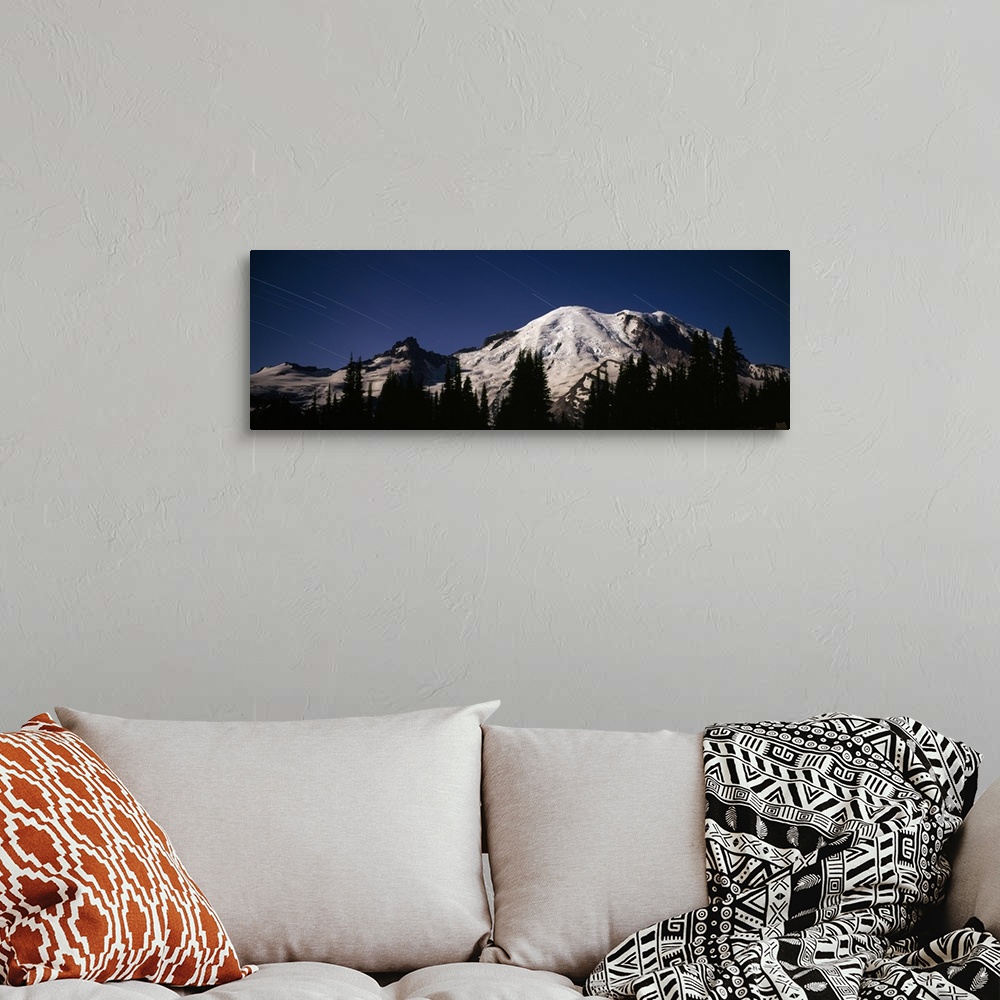 A bohemian room featuring Star trails over mountains, Mt Rainier, Washington State,