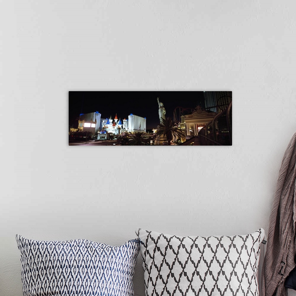 A bohemian room featuring Panoramic photograph of the Las Vegas strip at night, the Statue of Liberty and New York, New Yor...