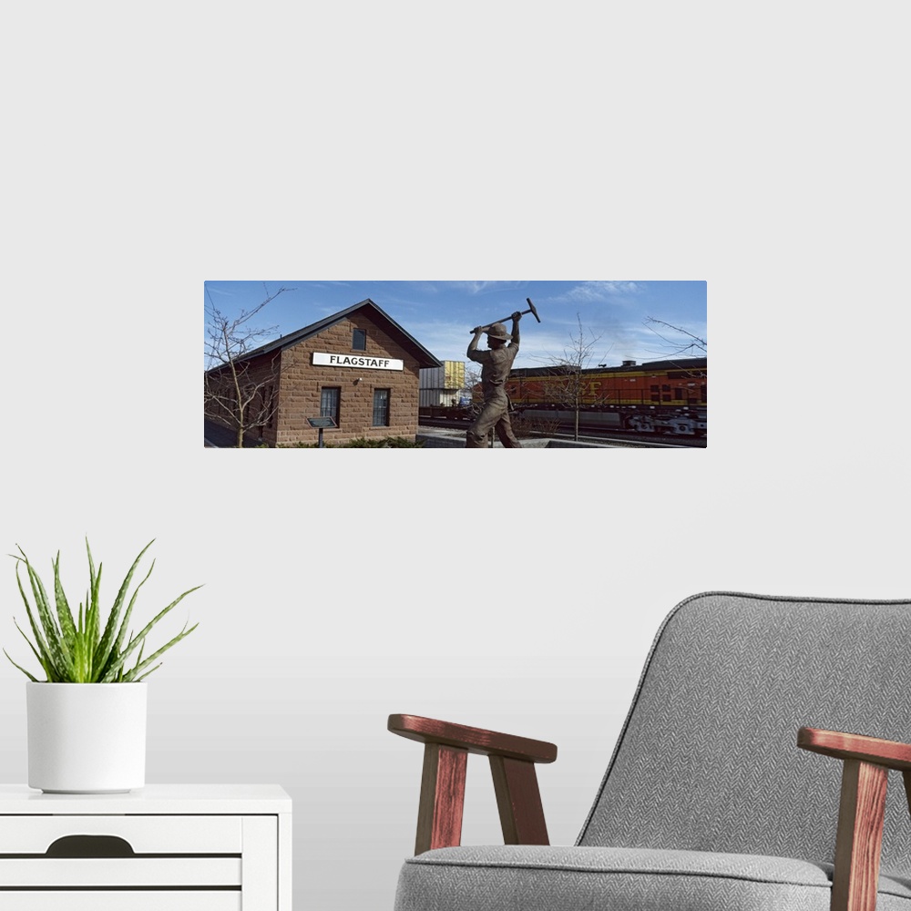 A modern room featuring Statue in front of a railroad depot, Flagstaff, Coconino County, Arizona