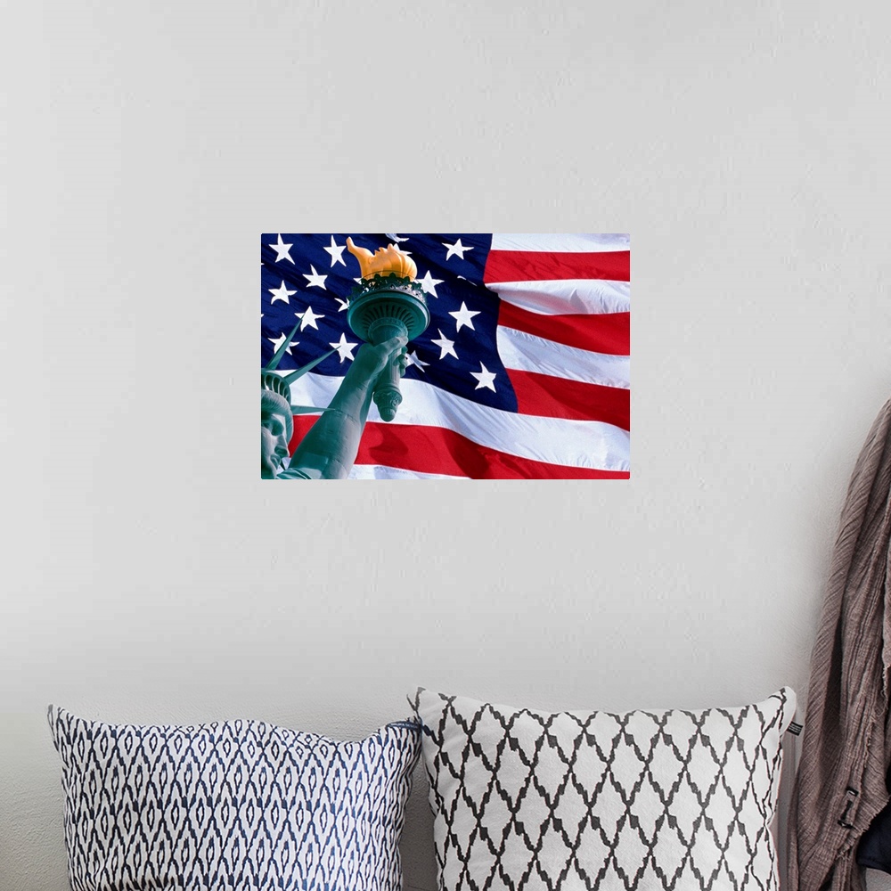 A bohemian room featuring Large, landscape photograph of the American Flag, the face of the Statue of Liberty in the bottom...
