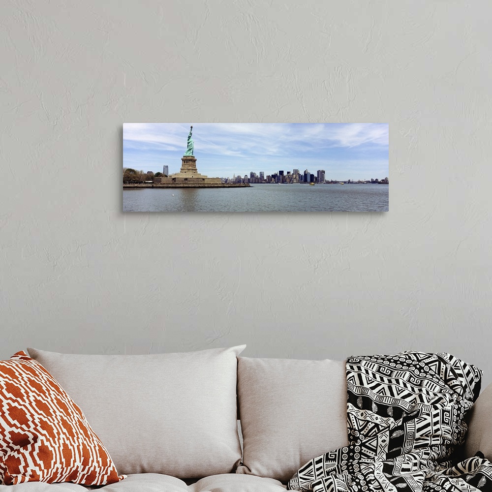 A bohemian room featuring Big panoramic photo on canvas of the Statue of Liberty with the NYC cityscape in the distance.