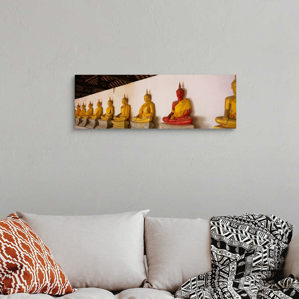 A bohemian room featuring Statues of Buddha in a temple, Wat Phutthaisawan, Ayuthaya, Thailand