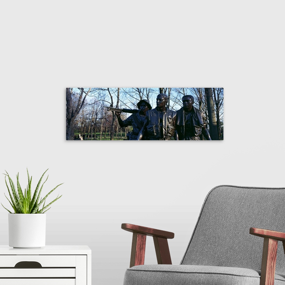 A modern room featuring Statues of three soldiers at a war memorial The Three Soldiers Vietnam Veterans Memorial Washingt...