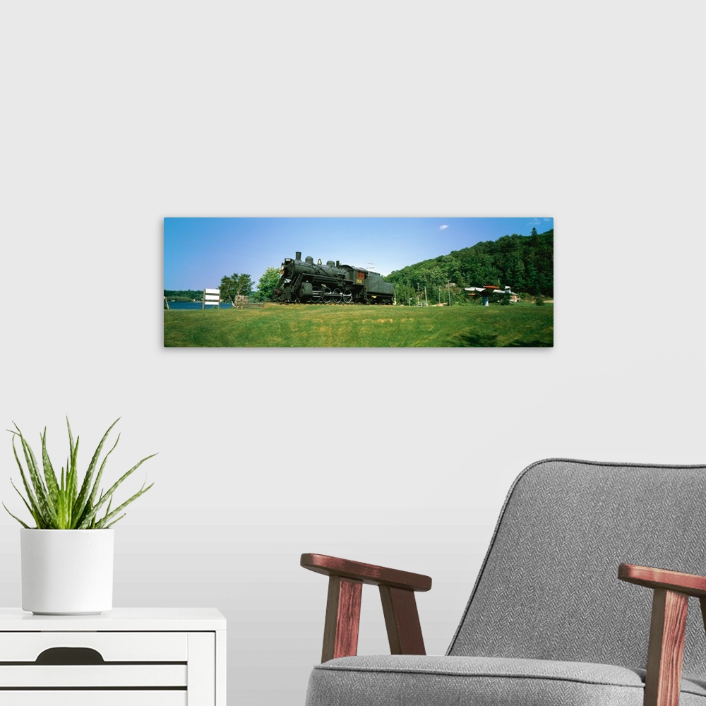 A modern room featuring Steam train in a field near Lake Kashagawigamog, Haliburton, Ontario, Canada