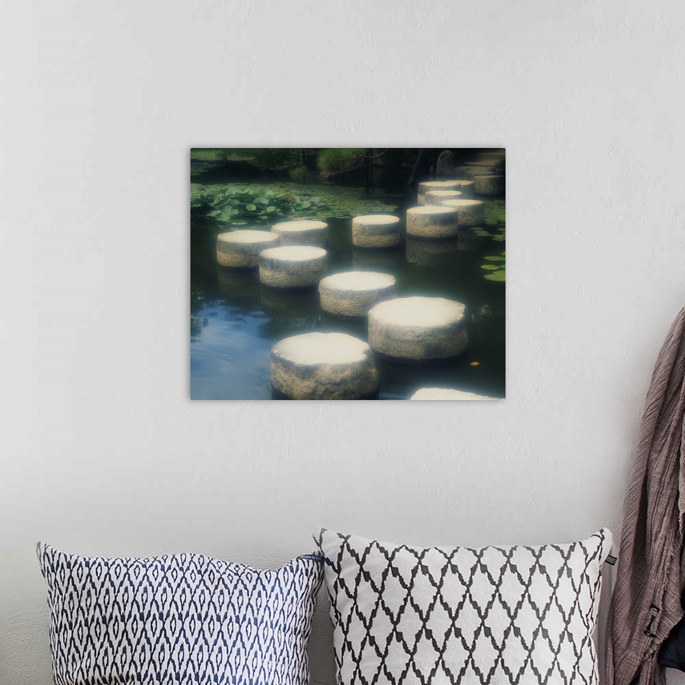A bohemian room featuring Large photo of a walkway of rocks across the water in a Japanese garden in Kyoto, Japan.
