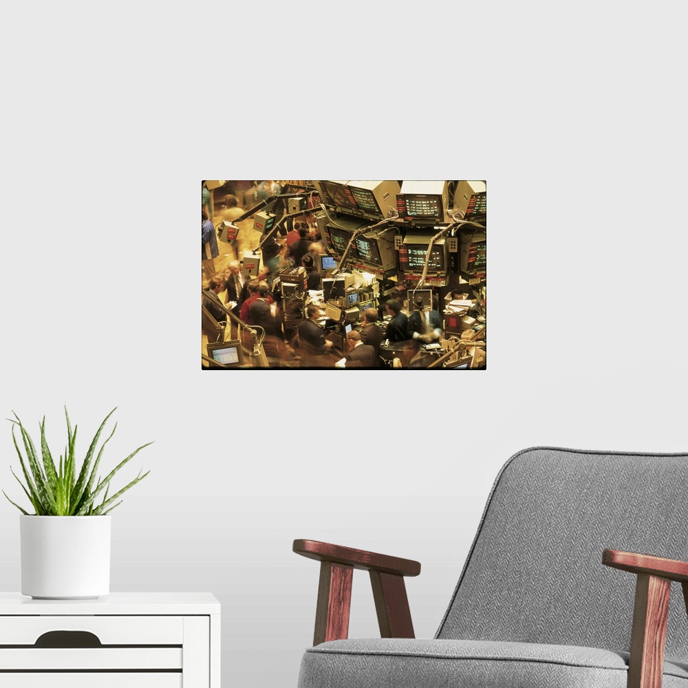 A modern room featuring This is a retro photograph of the trading floor in New York from the 1980s where brokers are work...