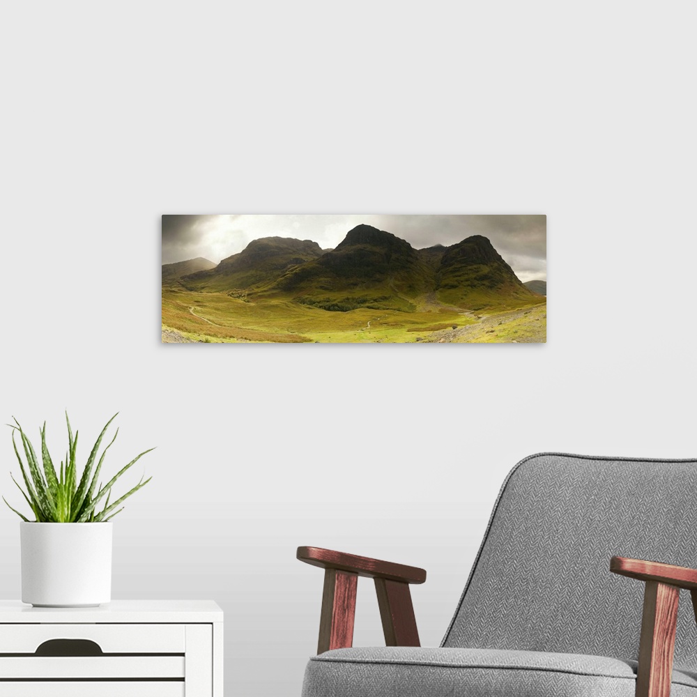 A modern room featuring Storm clouds over a mountain range, Three Sisters of Glen Coe, Scotland