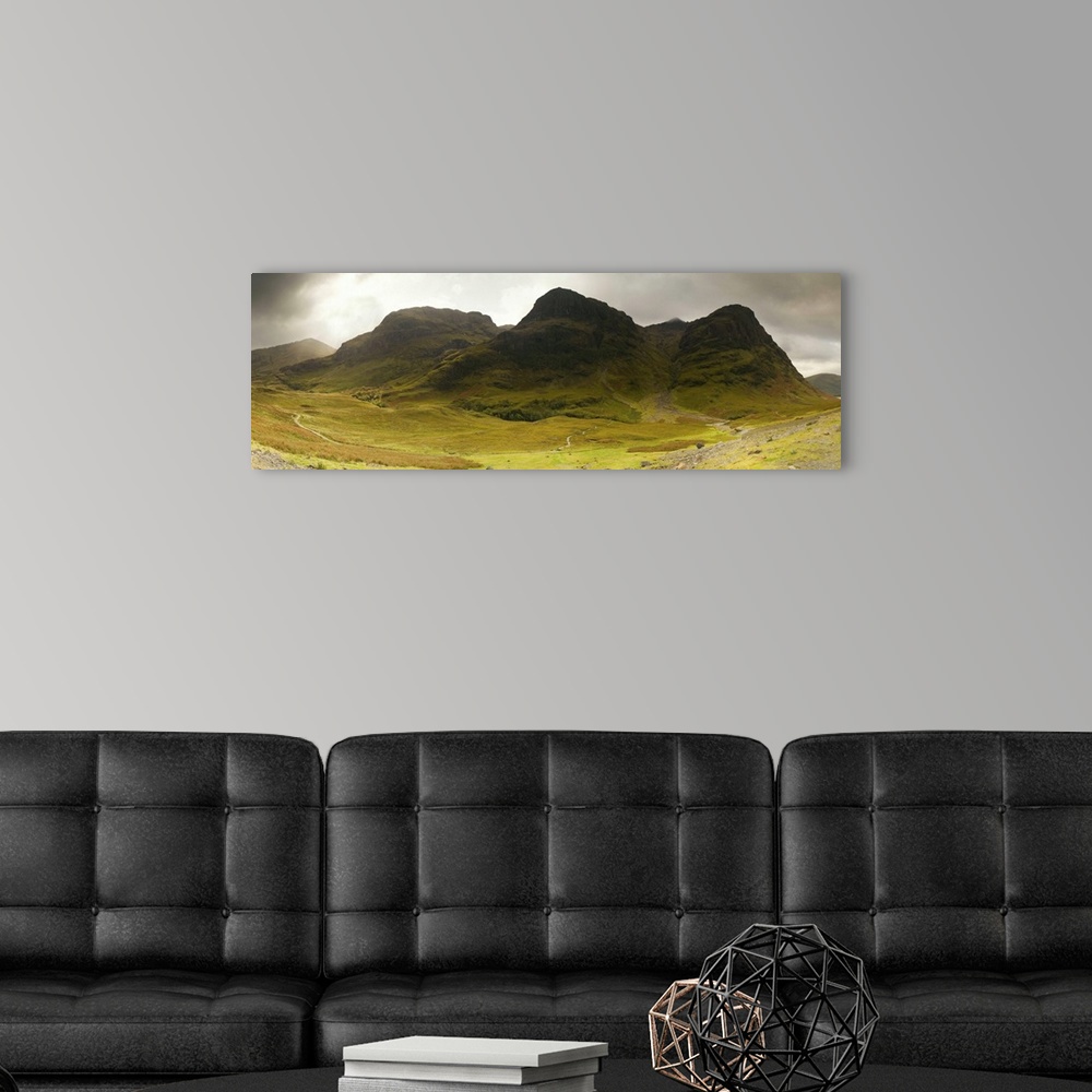 A modern room featuring Storm clouds over a mountain range, Three Sisters of Glen Coe, Scotland