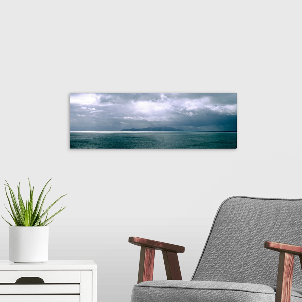 A modern room featuring Storm clouds over the sea New Zealand
