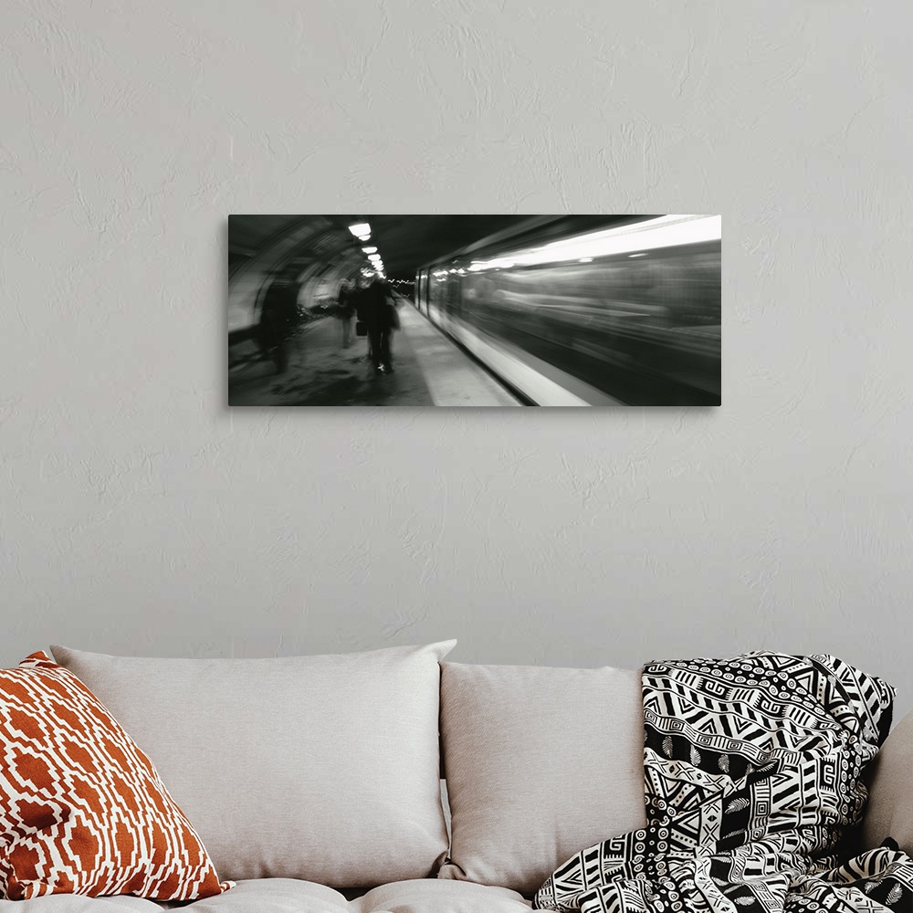 A bohemian room featuring Subway train passing through a subway station, London, England
