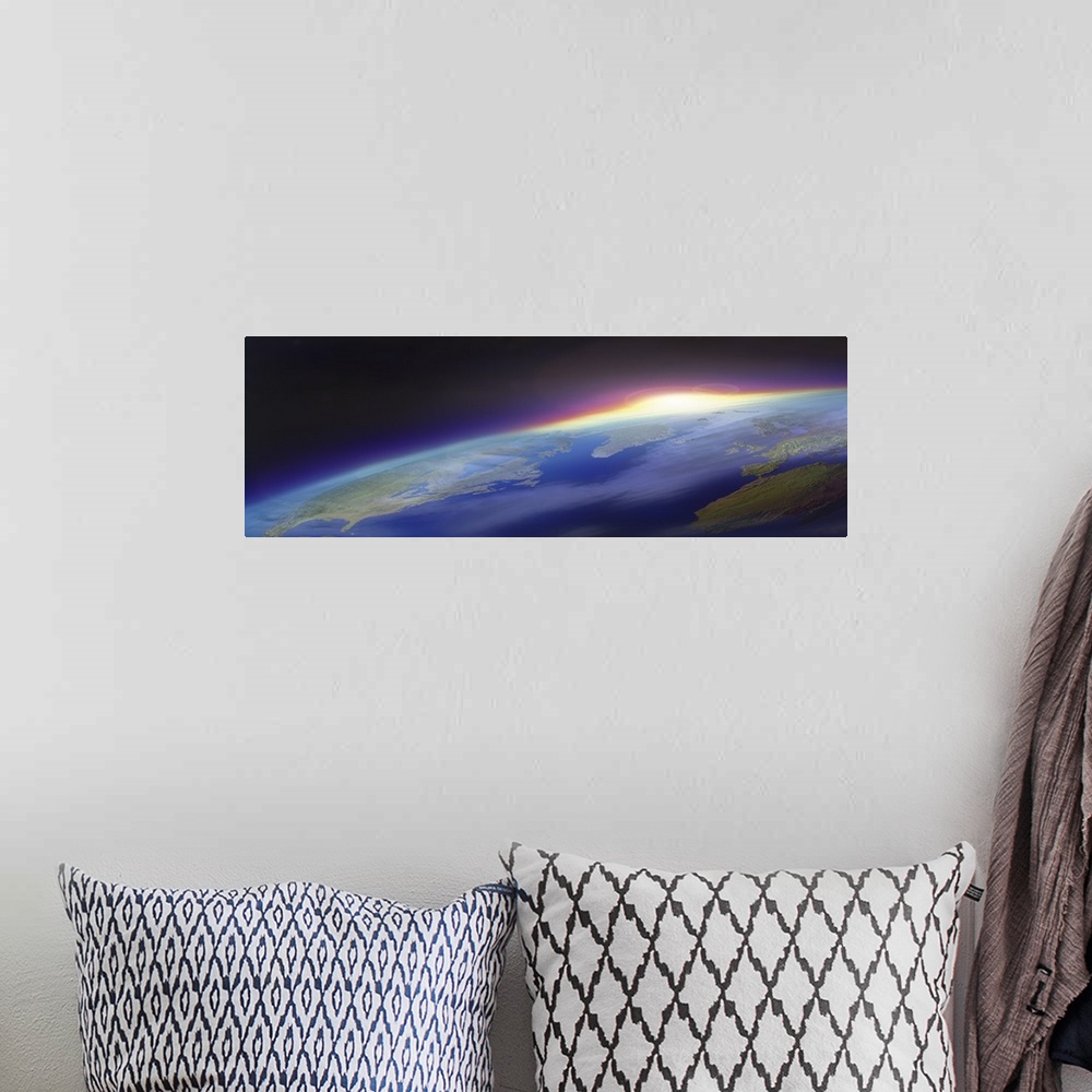 A bohemian room featuring Big panoramic photo from space of the sun beginning to rise over planet Earth. Land mass of the U...