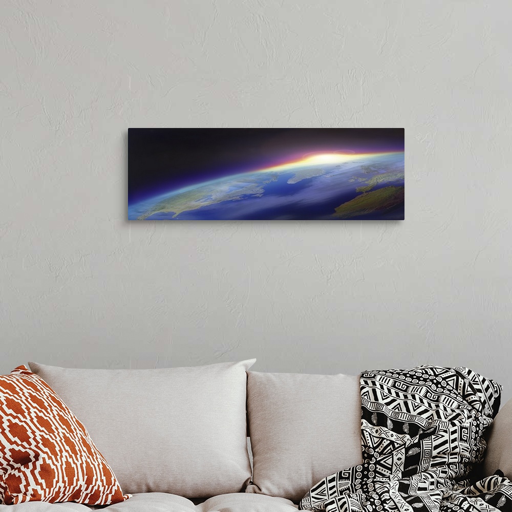 A bohemian room featuring Big panoramic photo from space of the sun beginning to rise over planet Earth. Land mass of the U...
