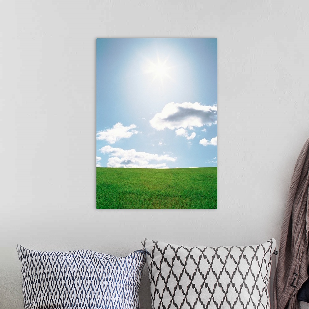 A bohemian room featuring Sun shining with clouds over grassland