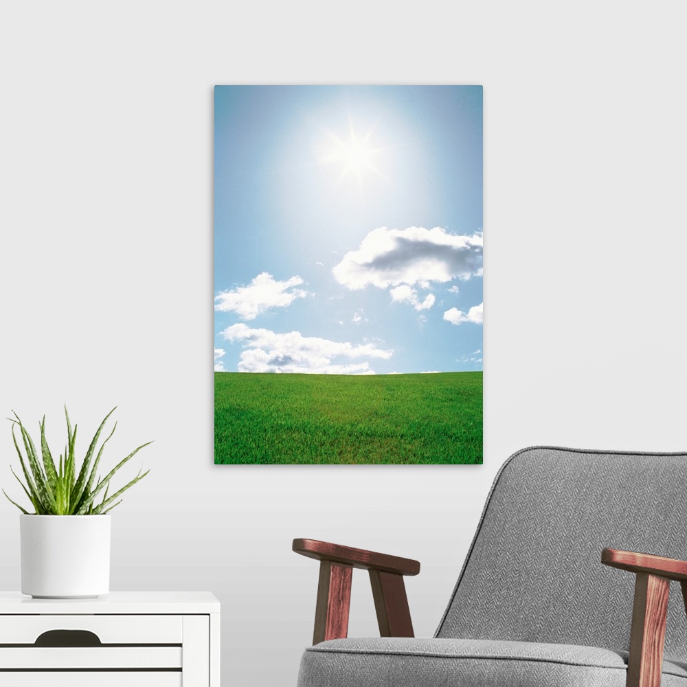 A modern room featuring Sun shining with clouds over grassland