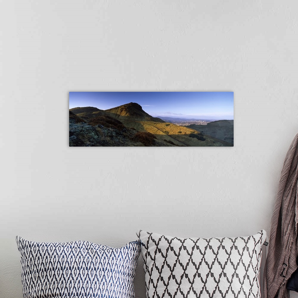 A bohemian room featuring Sunlight over a mountain peak Arthurs Seat Edinburgh Scotland