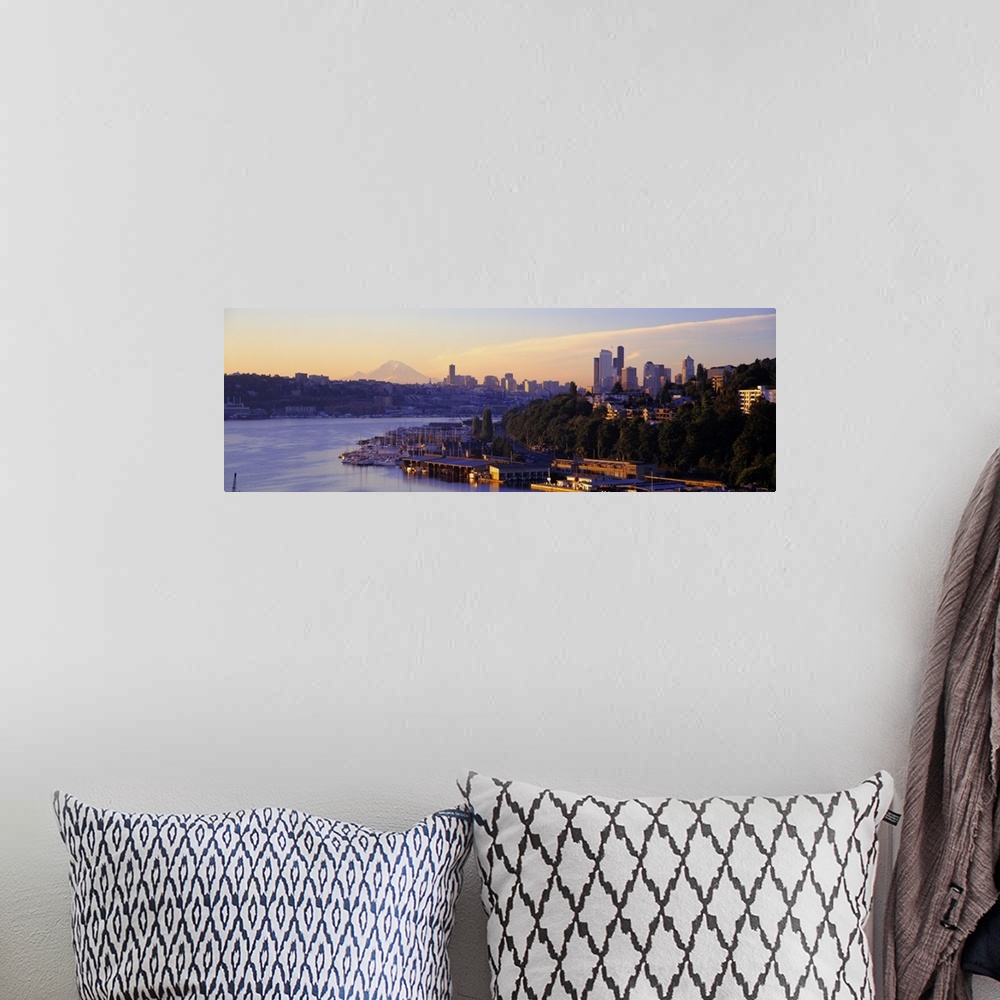 A bohemian room featuring Dawn on the shoreline of a harbor in a Northwestern city, with the faint image Mount Rainier in t...
