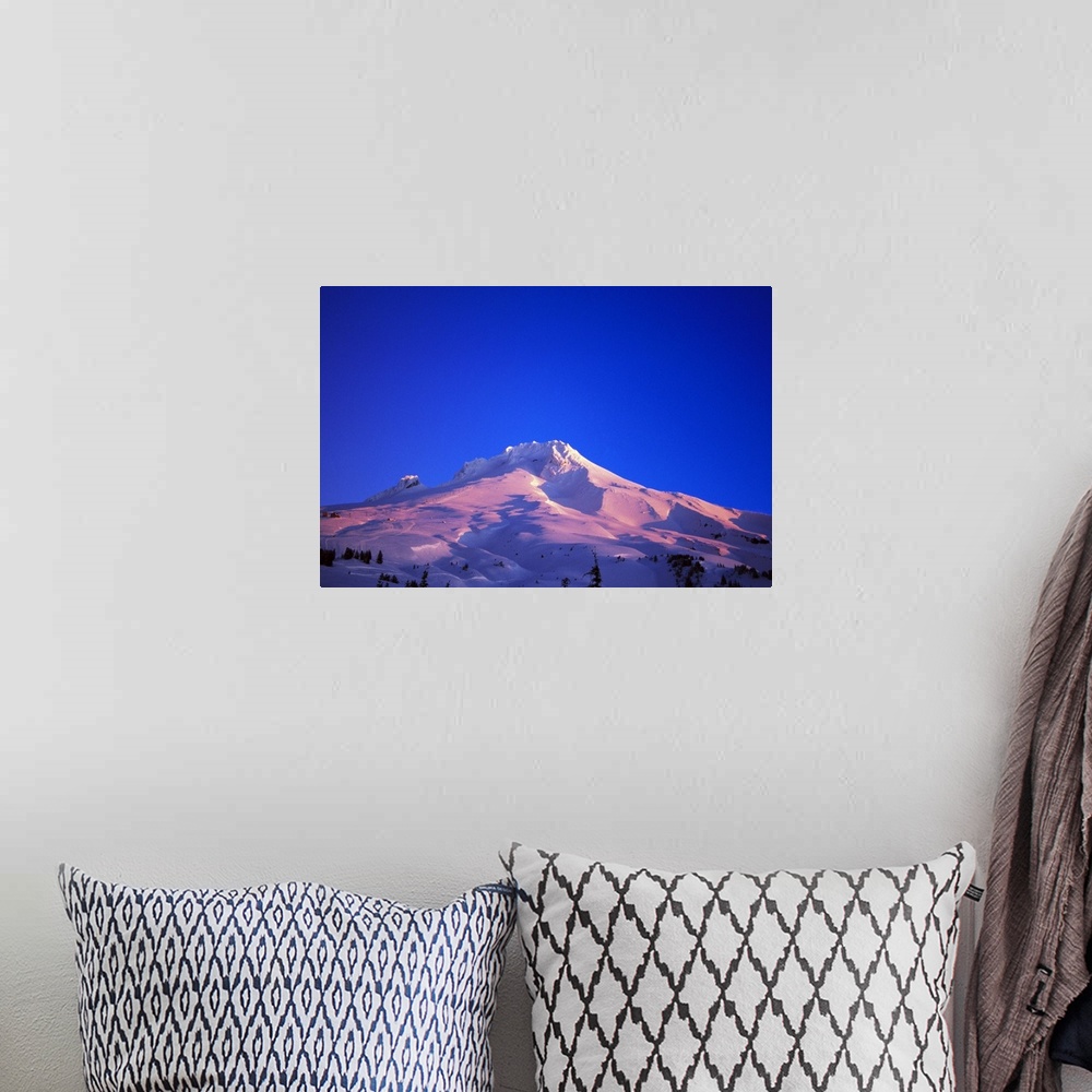 A bohemian room featuring Sunrise light on snowy Mount Hood, clear blue sky, Oregon, united states,