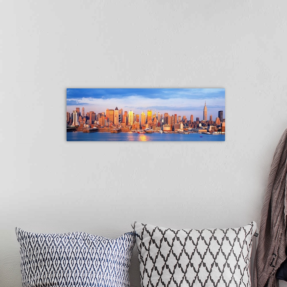 A bohemian room featuring Panoramic photograph taken of the sun as it begins to shine over the New York skyline filled with...