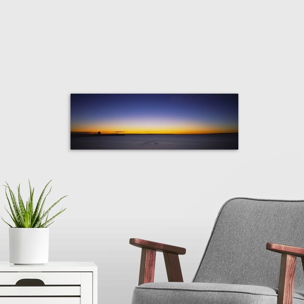 A modern room featuring Sunrise over a lake, Lake Huron, Straits of Mackinac, Mackinaw City, Michigan
