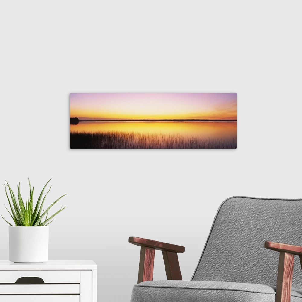A modern room featuring Sunrise over a lake, North Bay, Lake Michigan, Door County, Wisconsin