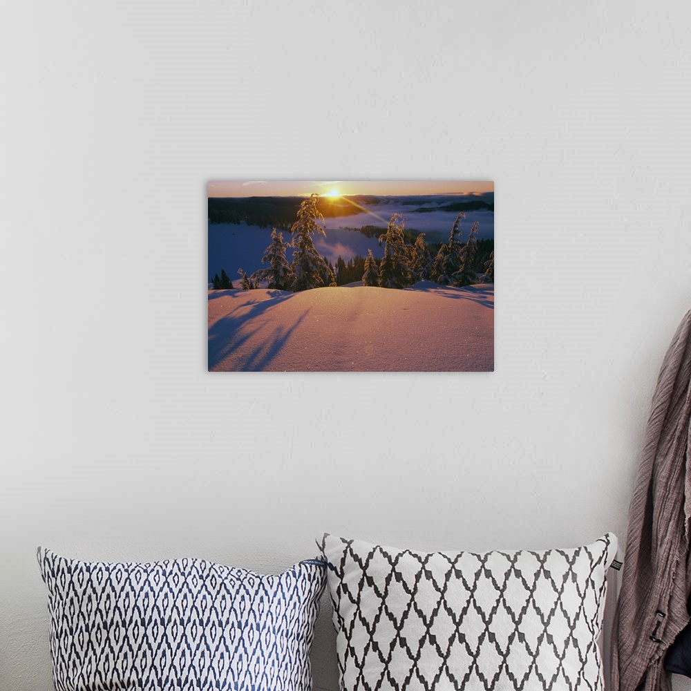 A bohemian room featuring This dramatic landscape photograph captures the sun ascending over the mountain ridge and illumin...