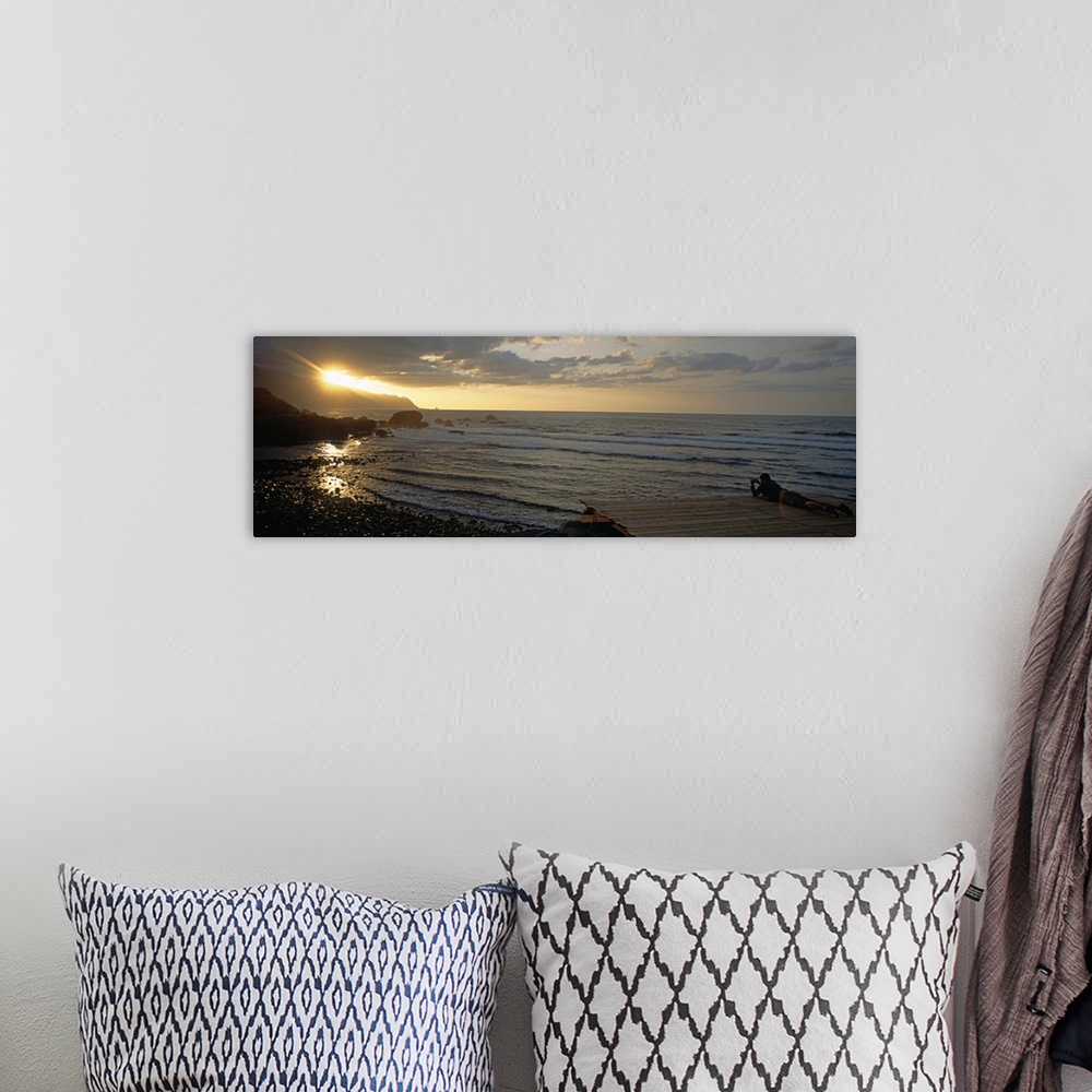 A bohemian room featuring Sunrise over the sea, Porto Moniz, Madeira, Portugal