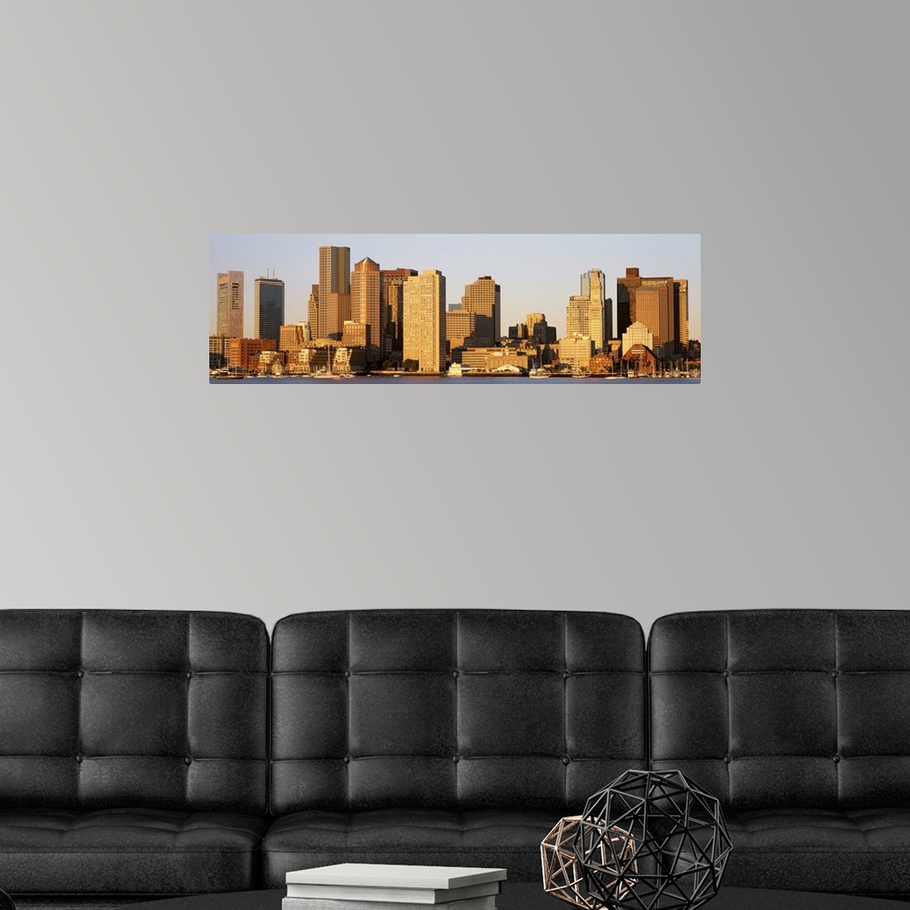 A modern room featuring Huge, panoramic photograph of the Boston skyline in the morning sun.