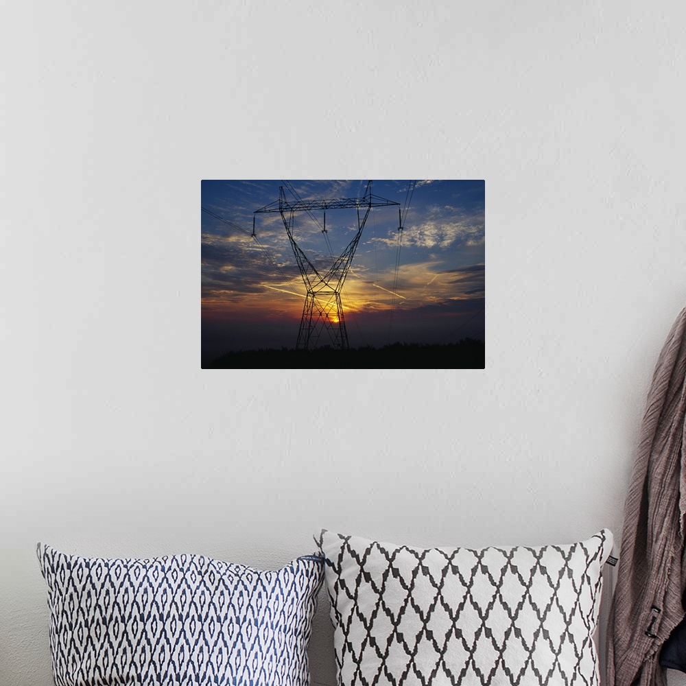 A bohemian room featuring Sunset behind high tension power lines.