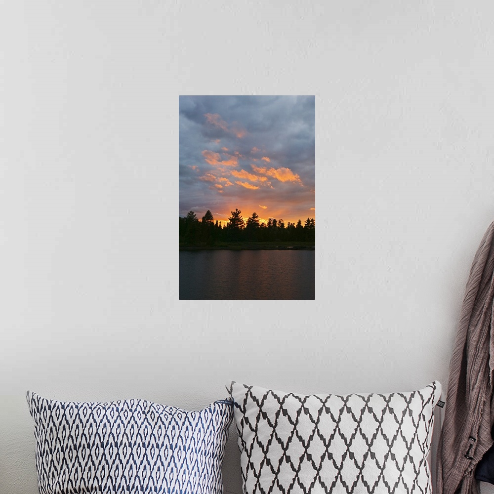 A bohemian room featuring Sunset behind silhouetted forest, Lake Three, Boundary Waters Canoe Area Wilderness, Minnesota
