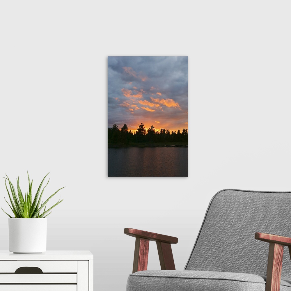 A modern room featuring Sunset behind silhouetted forest, Lake Three, Boundary Waters Canoe Area Wilderness, Minnesota
