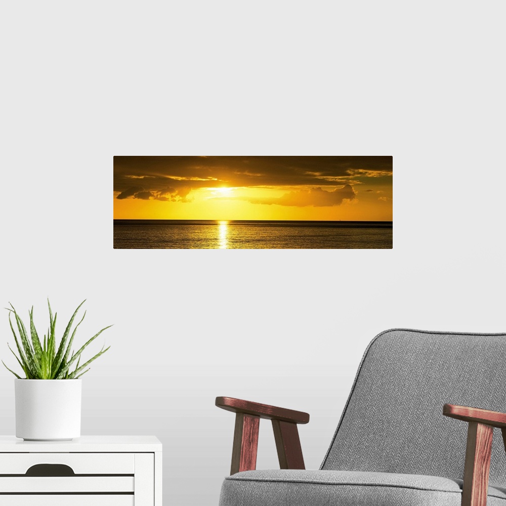 A modern room featuring Sunset Caribbean Sea