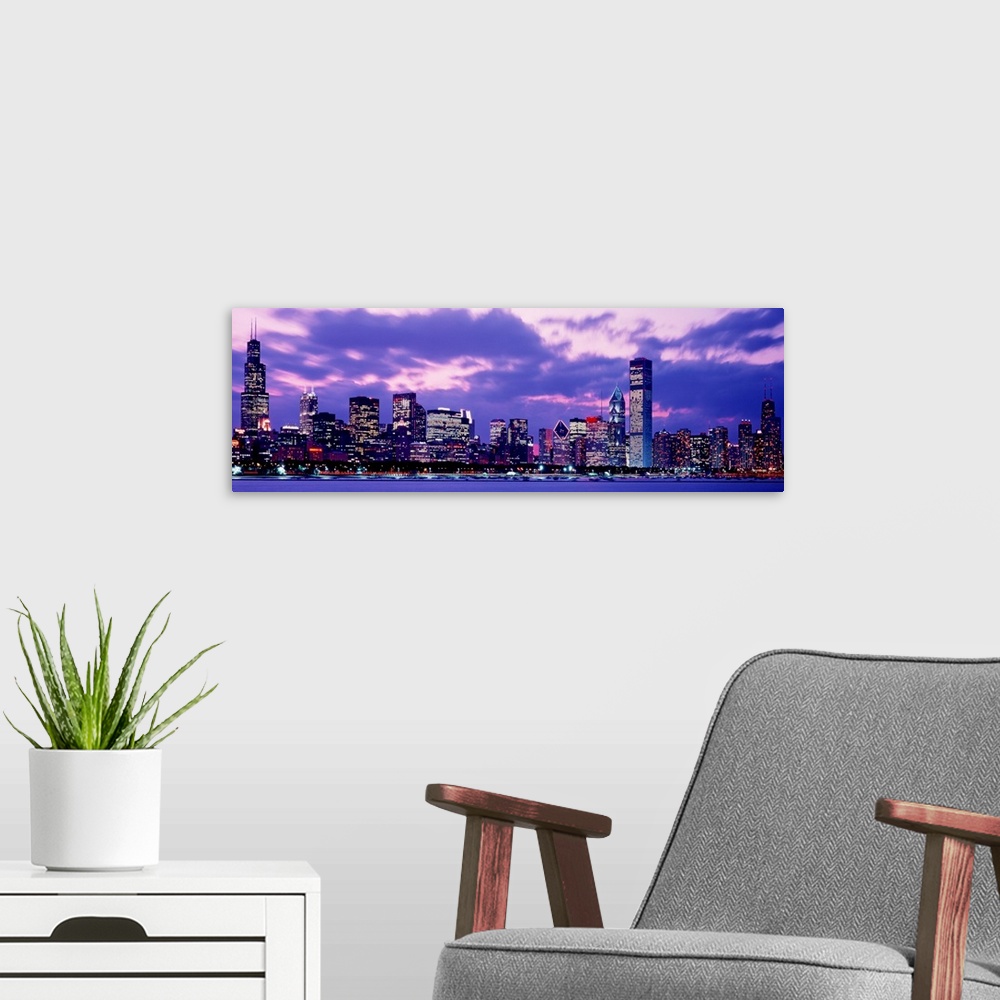 A modern room featuring A panoramic landscape photograph taken from on Lake Michigan of the city skyscrapers.