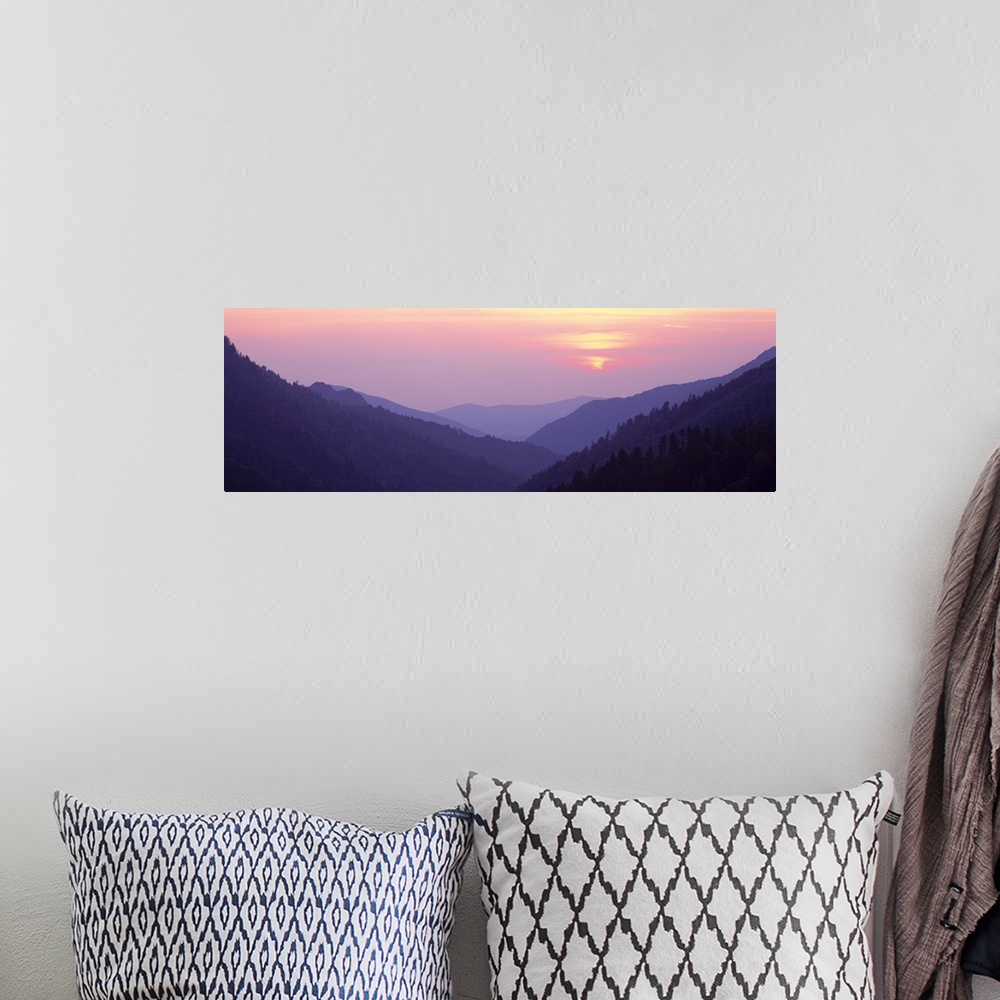 A bohemian room featuring Panoramic photo of rolling mountains in the fog at sunset.
