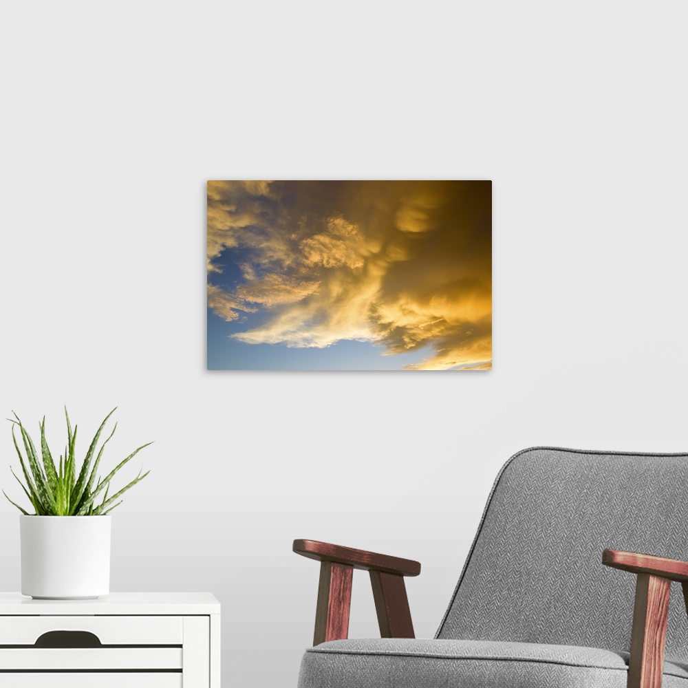 A modern room featuring Sunset Light On Clouds