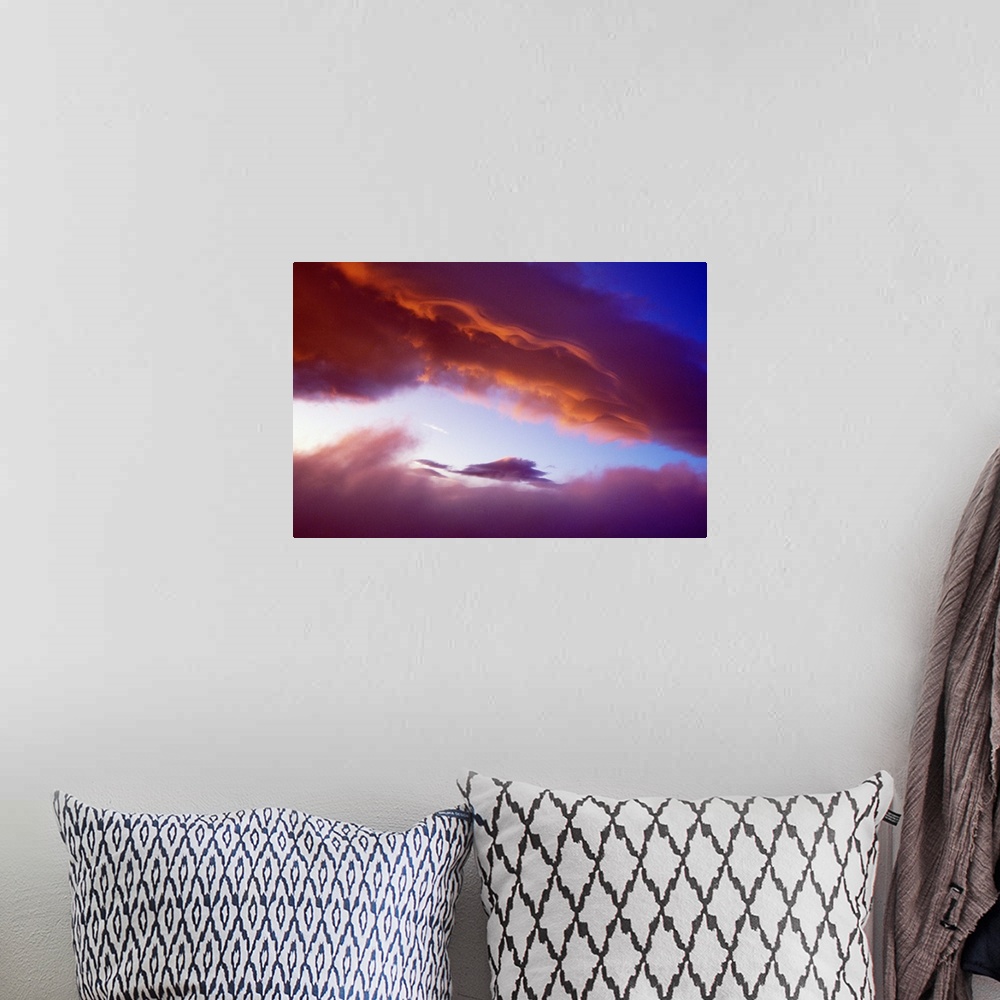 A bohemian room featuring Sunset Light On Clouds