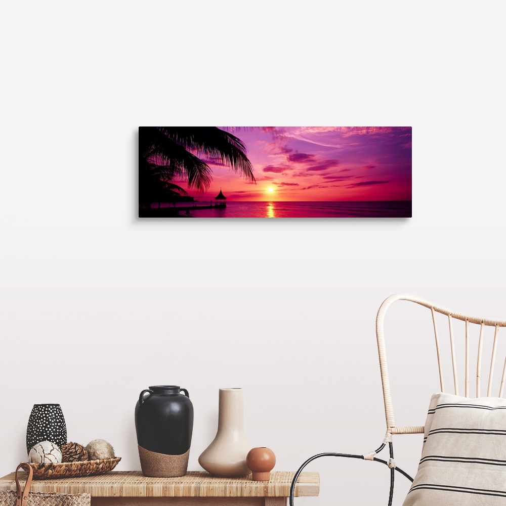 A farmhouse room featuring Panoramic photograph of a colorful sunset on the beach in Montego Bay, Jamaica.  The palm trees a...