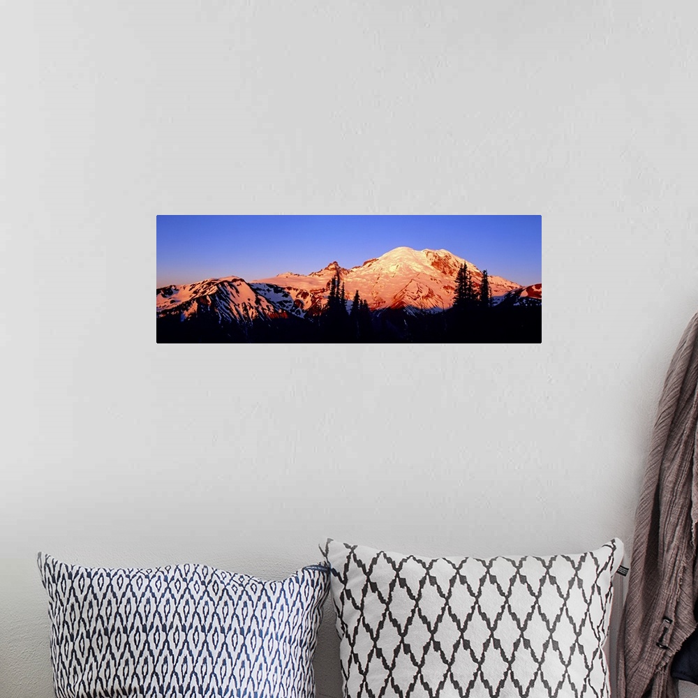 A bohemian room featuring Panoramic photograph taken of snow topped mountains during sunset with the trees in front silhoue...
