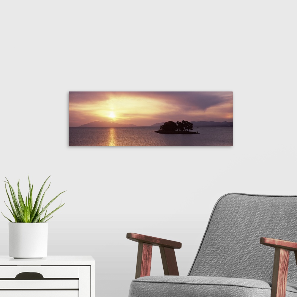 A modern room featuring Sunset over a lake, Yomegashima Island, Lake Shinji, Matsue, Shimane Prefecture, Chugoku Region, ...