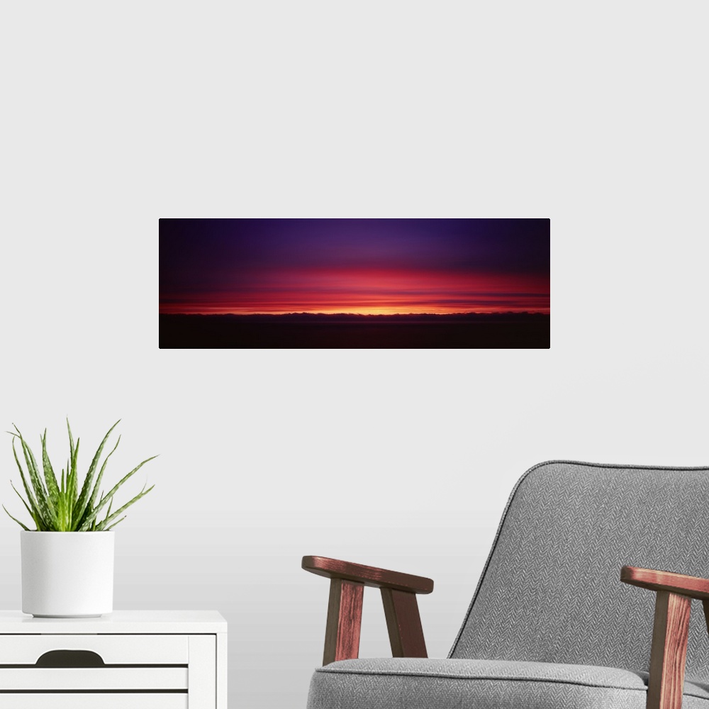 A modern room featuring Sunset over a landscape, Big Sur, California