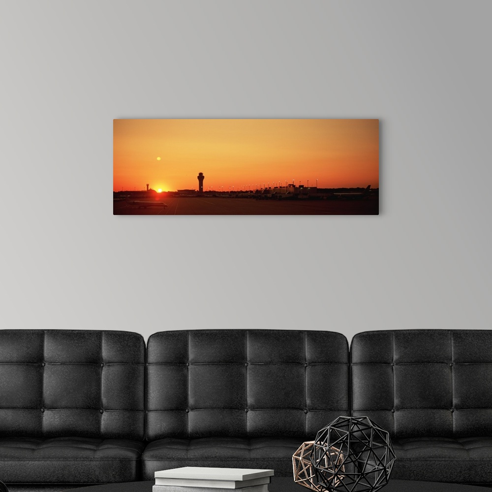 A modern room featuring Sunset over an airport, O'Hare International Airport, Chicago, Illinois