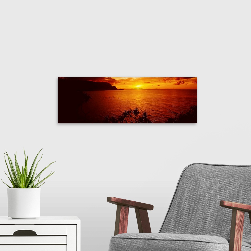 A modern room featuring Sunset over an ocean, Hanalei Bay, Kauai, Hawaii